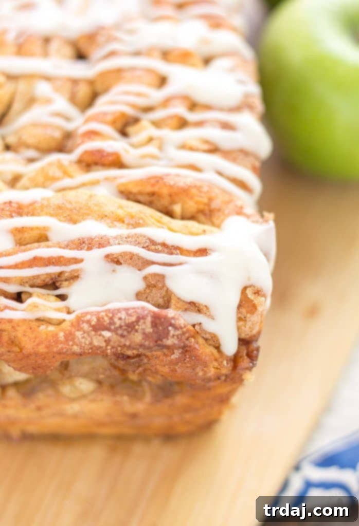 Apple Pie Pull Apart Bread is filled with chopped apples, cinnamon, brown sugar and drizzled with a cream cheese glaze. Sure to give Apple Pie a run for its money! | Strawberry Blondie Kitchen