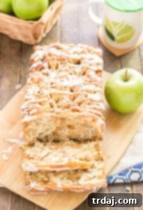 A quick layered bread filled with chopped apples, cinnamon, brown sugar and drizzled with a cream cheese glaze. Sure to give Apple Pie a run for its money! | Strawberry Blondie Kitchen