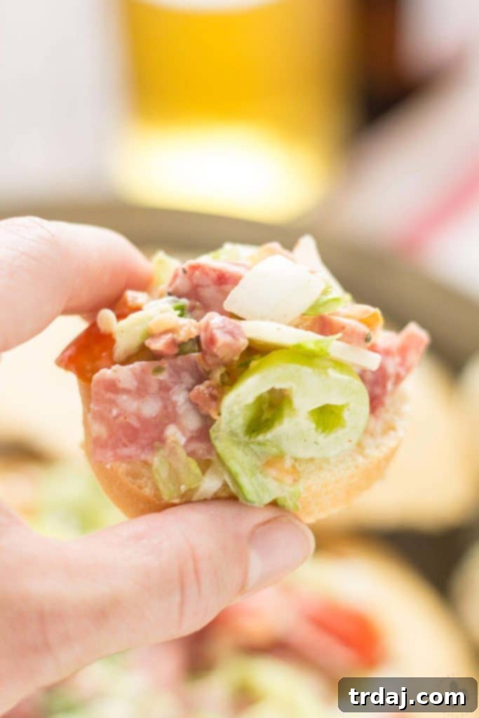 Chicago Style Hoagie Dip served in a bread bowl with giardiniera and French bread slices