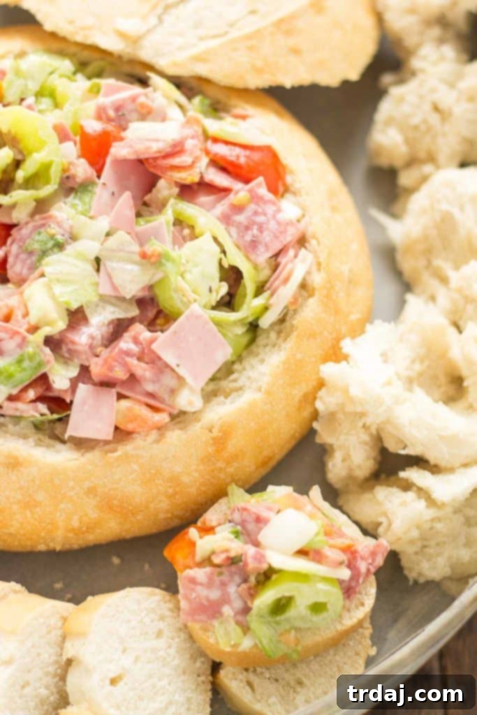 Close-up of Chicago Style Hoagie Dip, showcasing meats, cheese, and fresh ingredients