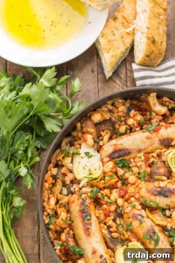 Close-up of a rustic wooden spoon serving One-Pan Tuscan Italian Sausages, emphasizing the hearty texture and rich sauce.
