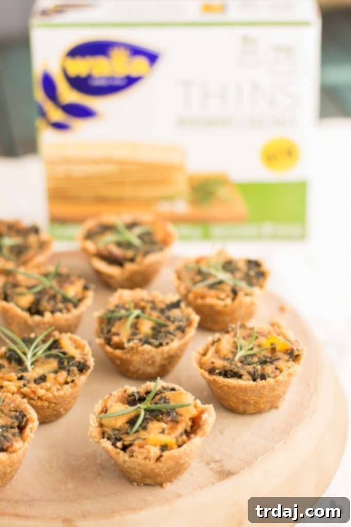 Delicious Rosemary Cracker Bites with Goat Cheese, Kale and Potatoes, perfect for holiday gatherings and easy entertaining. | Strawberry Blondie Kitchen