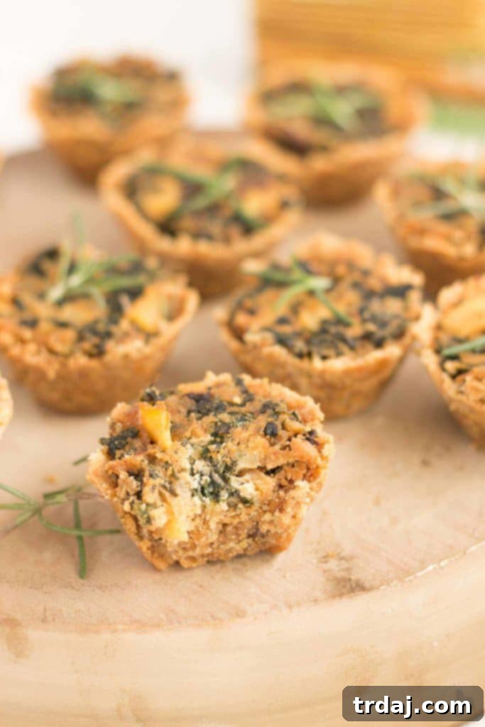 Goat Cheese, Kale, and Potato Rosemary Cracker Bites 8 Close-up of a delicious Rosemary Cracker Bite, showcasing the savory filling. | Strawberry Blondie Kitchen