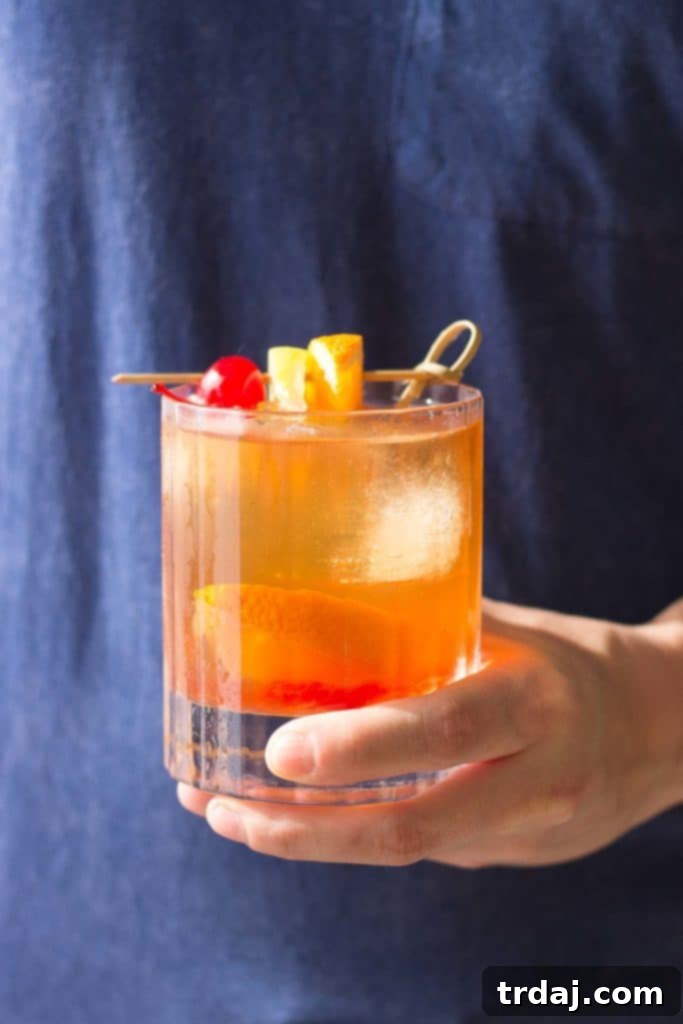 Black Walnut Old Fashioned: A sophisticated bourbon cocktail with warm, spicy notes perfect for holidays.