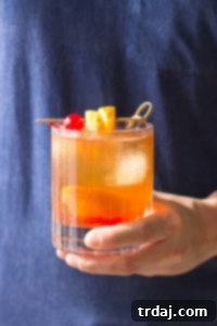 Black Walnut Old Fashioned: A sophisticated bourbon cocktail with warm, spicy notes perfect for holidays.