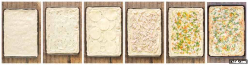 Turkey Pot Pie Pizza Bake 5 An overhead shot of the incredible Leftover Turkey Pot Pie Slab Pizza, generously topped with cheese, turkey, and vegetables, ready to be served at any gathering. | Strawberry Blondie Kitchen