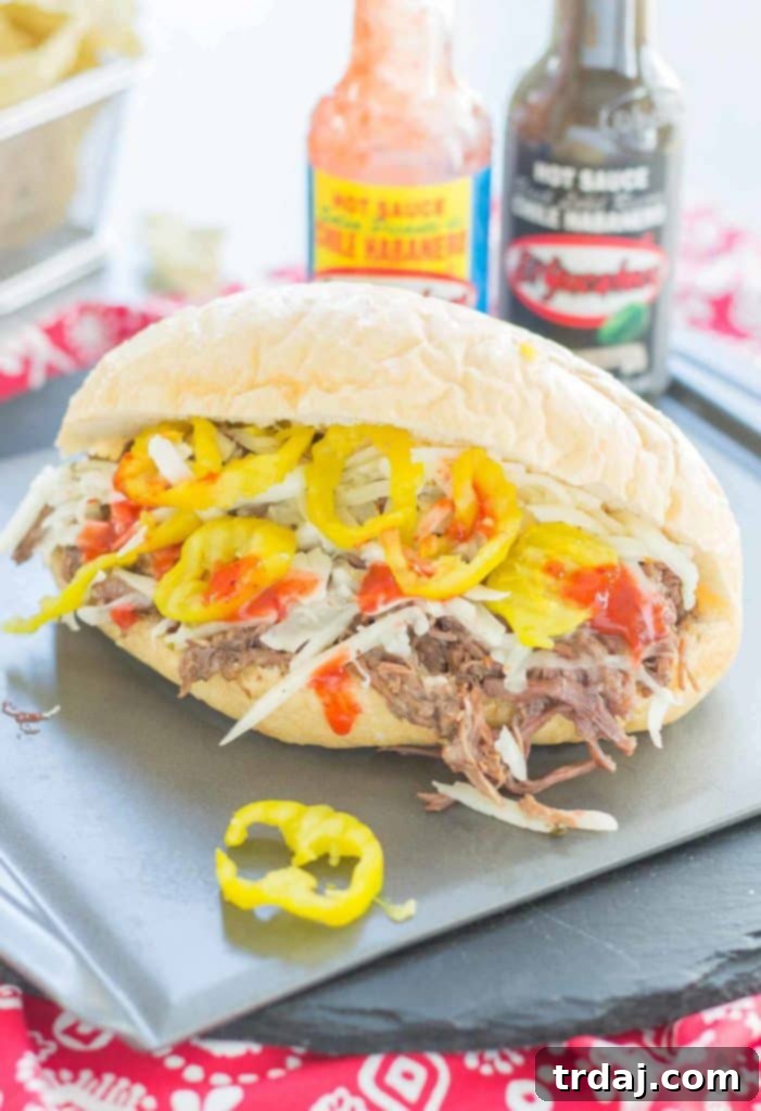 Slow-Cooked Short Rib Sandwiches 2 Tender slow cooked beef short ribs on bolillo rolls with El Yucateco hot sauce and cheese, perfect for ultimate Short Rib Sandwiches. | Strawberry Blondie Kitchen