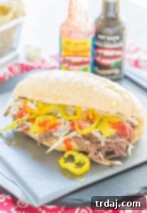 Slow-Cooked Short Rib Sandwiches 8 Tender slow cooked beef short ribs on bolillo rolls with El Yucateco hot sauce and cheese, perfect for ultimate Short Rib Sandwiches. | Strawberry Blondie Kitchen