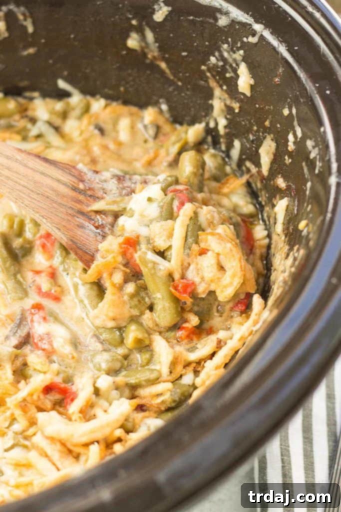 Creamy White Cheddar Green Bean Casserole (Slow Cooker) 3 Sharp white cheddar cheese elevates this Slow Cooker White Cheddar Green Bean Casserole to make it the star side dish of your holiday table! | Strawberry Blondie Kitchen