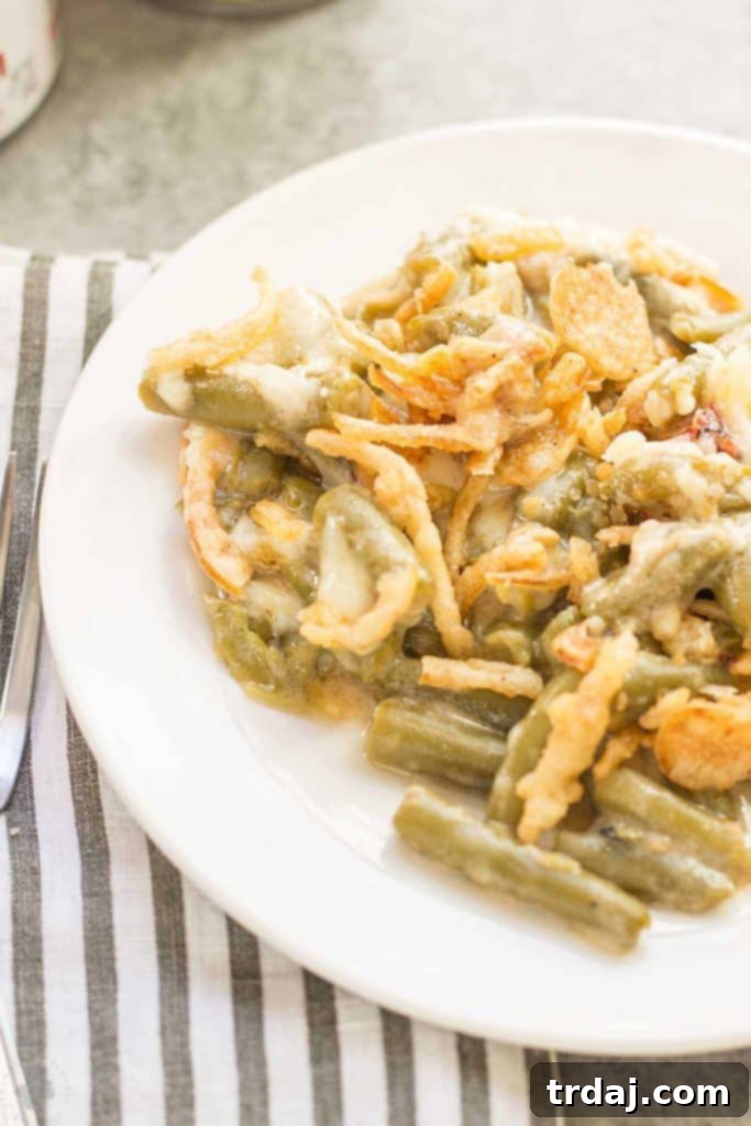 Creamy White Cheddar Green Bean Casserole (Slow Cooker) 4 Sharp white cheddar cheese elevates this Slow Cooker White Cheddar Green Bean Casserole to make it the star side dish of your holiday table! | Strawberry Blondie Kitchen