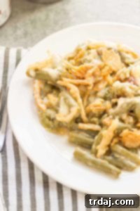 Creamy White Cheddar Green Bean Casserole (Slow Cooker) 8 Sharp white cheddar cheese elevates this Slow Cooker White Cheddar Green Bean Casserole to make it the star side dish of your holiday table! | Strawberry Blondie Kitchen