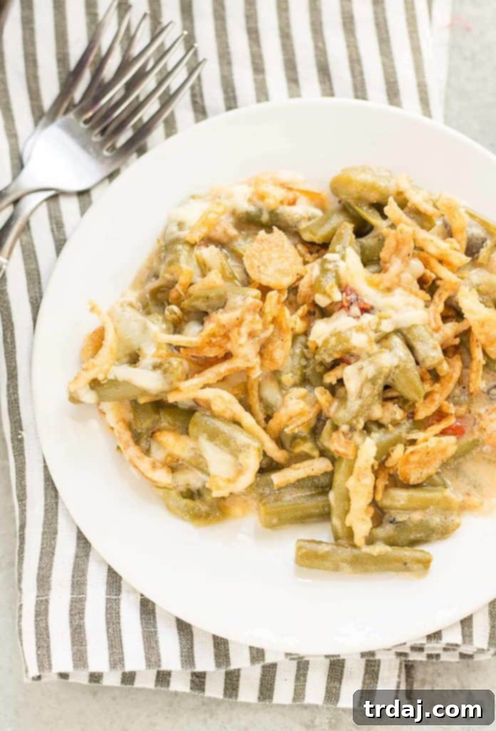 Creamy White Cheddar Green Bean Casserole (Slow Cooker) 9 Sharp white cheddar cheese elevates this Slow Cooker White Cheddar Green Bean Casserole to make it the star side dish of your holiday table! | Strawberry Blondie Kitchen