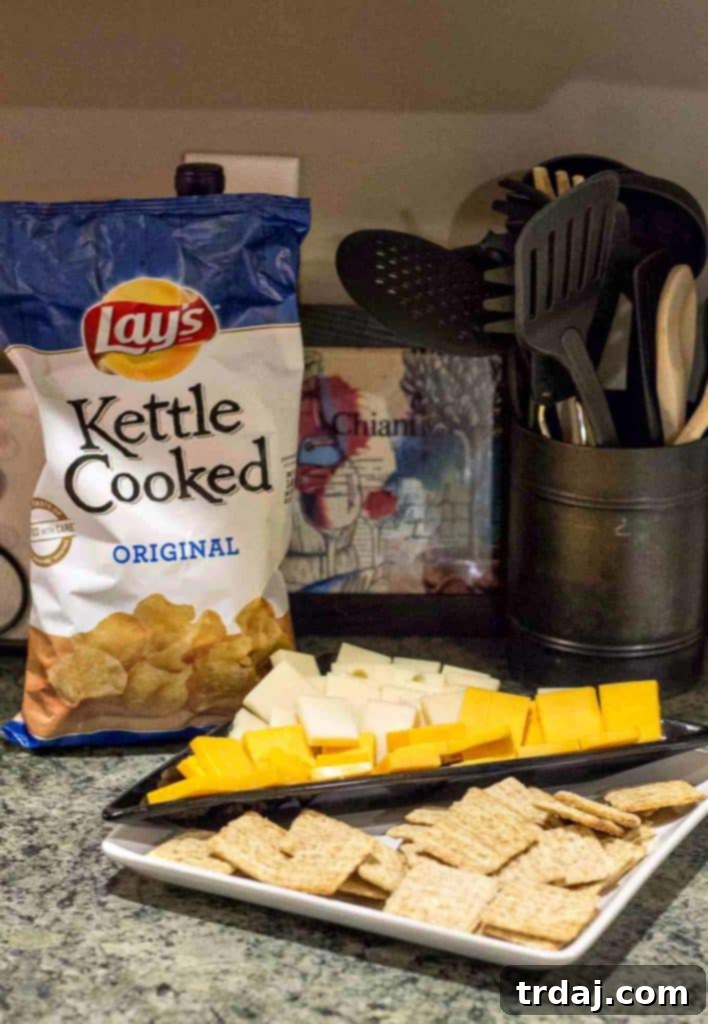 Beyond cookies, a Holiday Pajama and Cookie Party features a balanced spread of Frito Lay sweet and savory snacks like chocolate-covered chips, popcorn, and tortilla chips.
