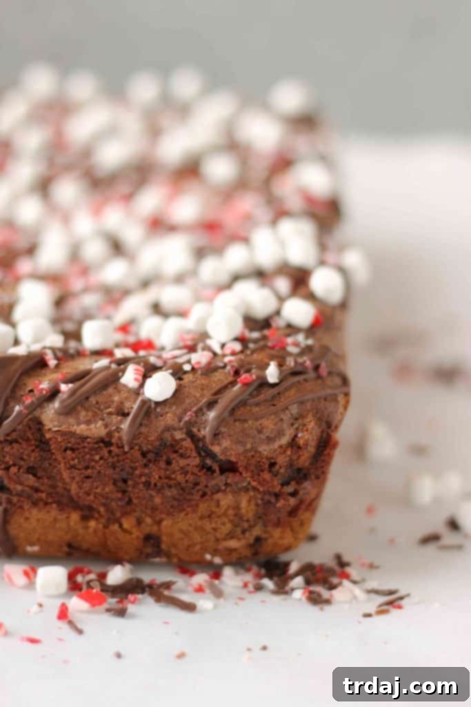 Layers of chocolate chip cookies and peppermint sandwich cookies in a brookie