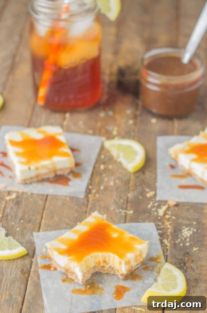 Arnold Palmer Cheesecake Bars: Tangy lemon cheesecake bars topped with a sweet tea caramel sauce, a perfect dessert fusion of two classic flavors.