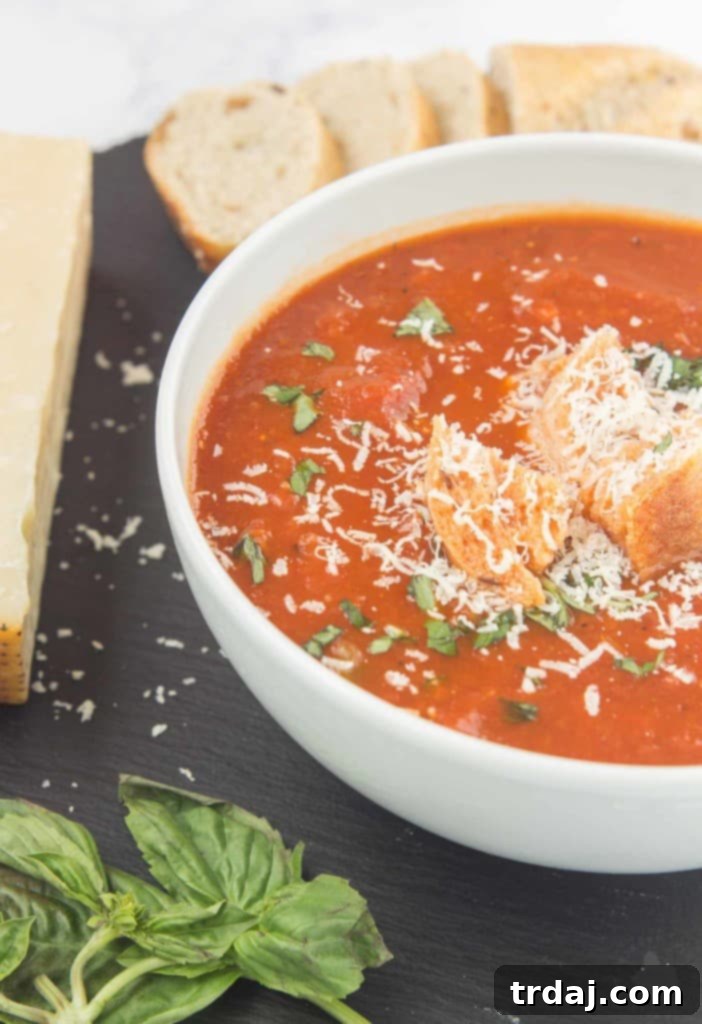 Slow Cooker Roasted Red Pepper and Tomato Soup: Garden vegetables roasted to perfection, then slow-cooked until tender, creating a delicious and comforting soup.