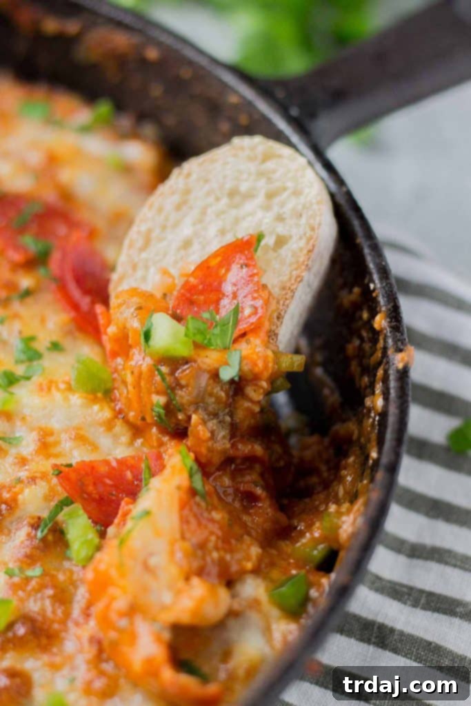 Sharing shot of Supreme Pizza Dip with various dippers for a party.