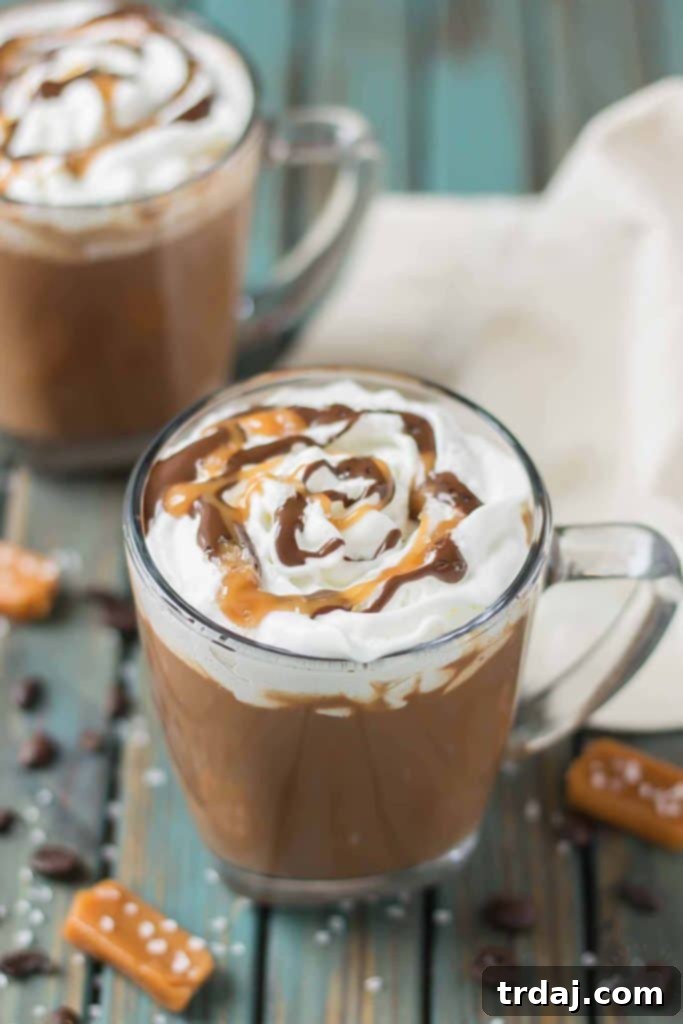 Decadent Sea Salt Caramel Mocha 2 Creamy espresso blends perfectly with chocolate and almond milk, topped with whipped cream, caramel drizzle and a sprinkle of sea salt, making this Sea Salt Caramel Mocha irresistibly delicious! | Strawberry Blondie Kitchen