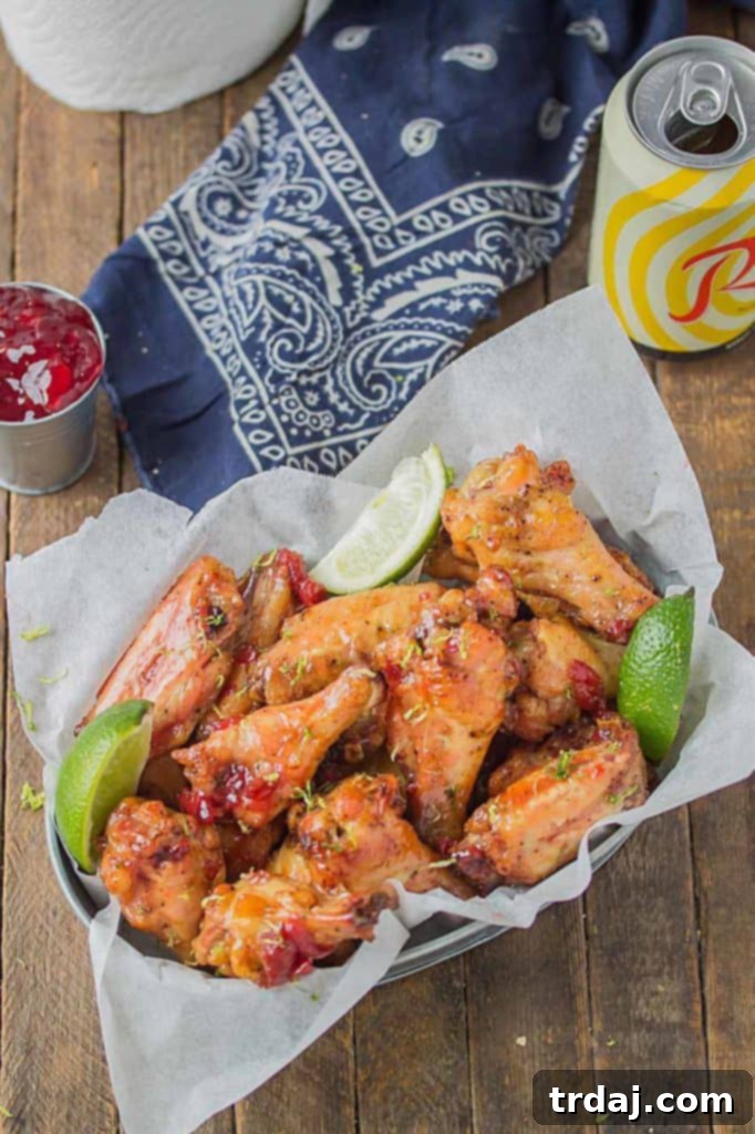 Sweet, tart and tangy, these Cherry Lime Baked Wings are delicious and addictive. Be sure to make a big batch, they're sure to be the hit of your next game day party! | Strawberry Blondie Kitchen