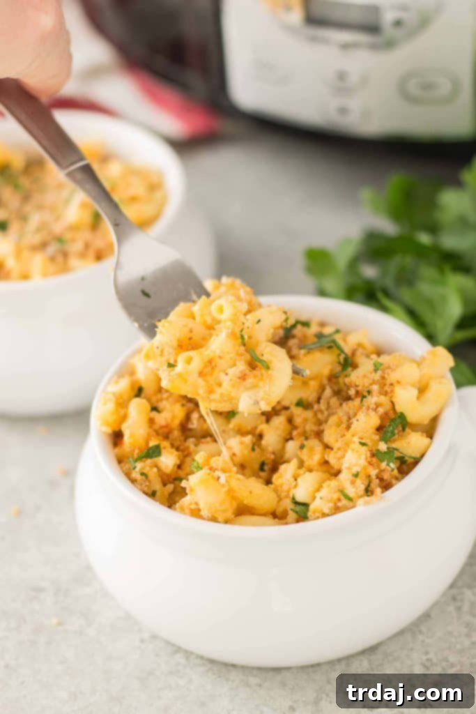 A close-up of the delicious slow cooker macaroni and cheese, showing its creamy texture and golden color.