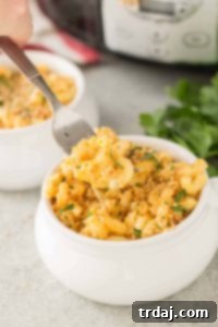 The ultimate cheesy, creamy, and easy slow cooker macaroni and cheese recipe perfect for family dinners.