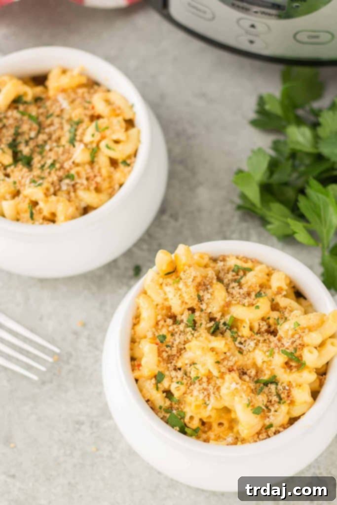 Another mouth-watering shot of slow cooker macaroni and cheese in a rustic bowl.