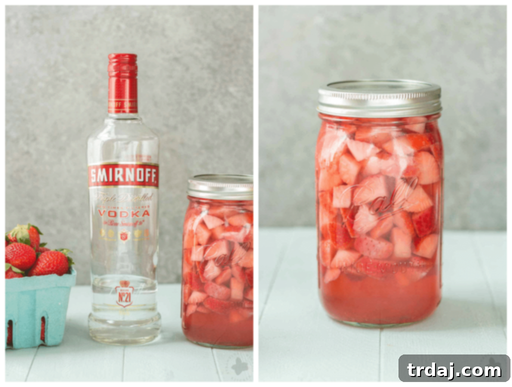Detailed shot of the homemade strawberry vodka infusion process, with diced strawberries soaking in vodka within a mason jar.
