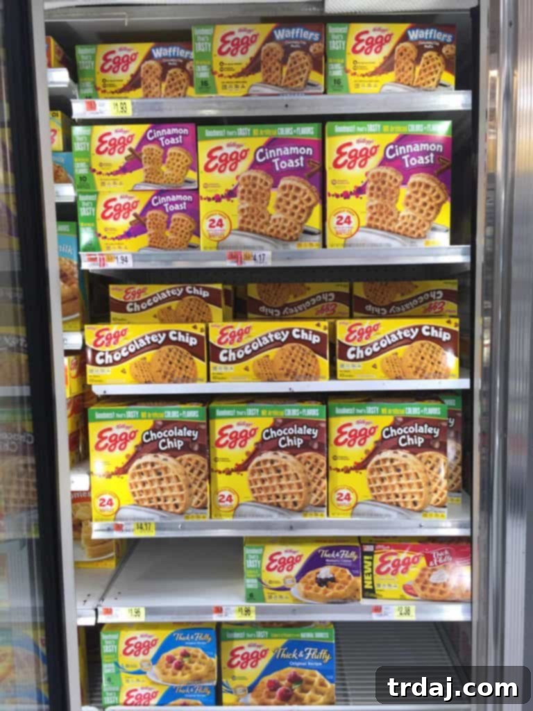 Waffle Pizza Pockets 5 A shopping cart brimming with Kellogg's Eggo Waffle boxes at Walmart, with a clear focus on the updated packaging highlighting 'no artificial flavors and colors from natural sources.' | Strawberry Blondie Kitchen