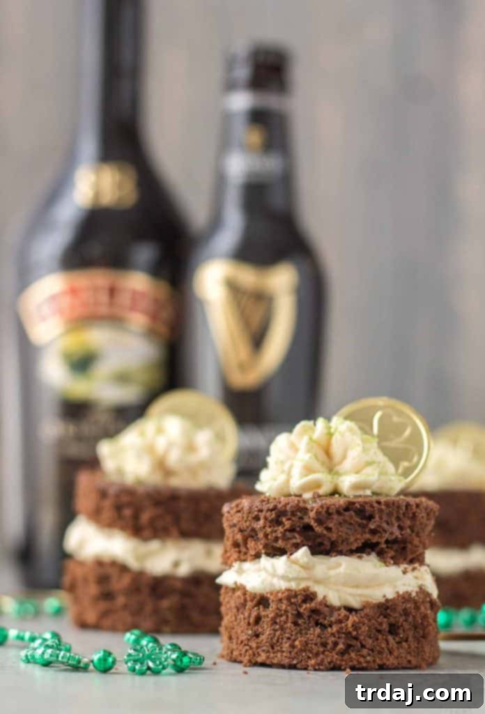 A festive spread for St. Patrick's Day featuring Chocolate Guinness Mini Cakes, green beer, and Irish decorations.