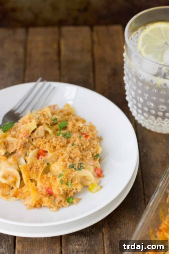 Lightened Up Cheesy Tuna Noodle Casserole baked to golden perfection, ready to be served.