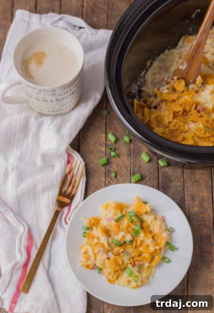 Crock-Pot Hash Brown Casserole 3 Close-up of golden brown Slow Cooker Hash Brown Casserole with melted cheese, ready to serve.