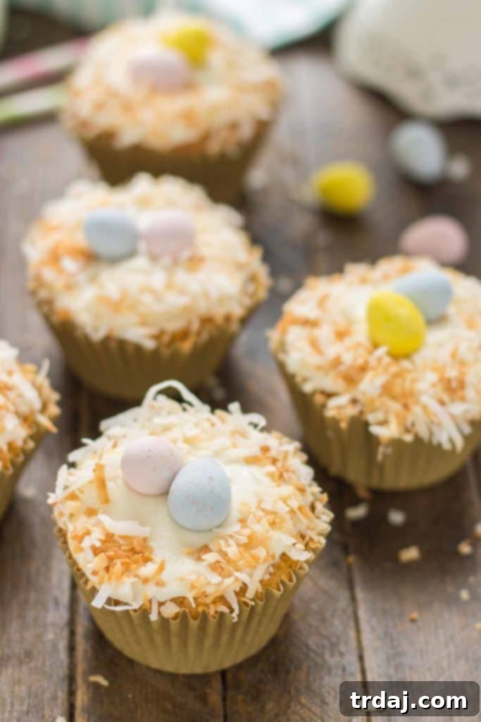 Top-down view of a beautifully frosted Pineapple Carrot Cake Cupcake, ready to be enjoyed