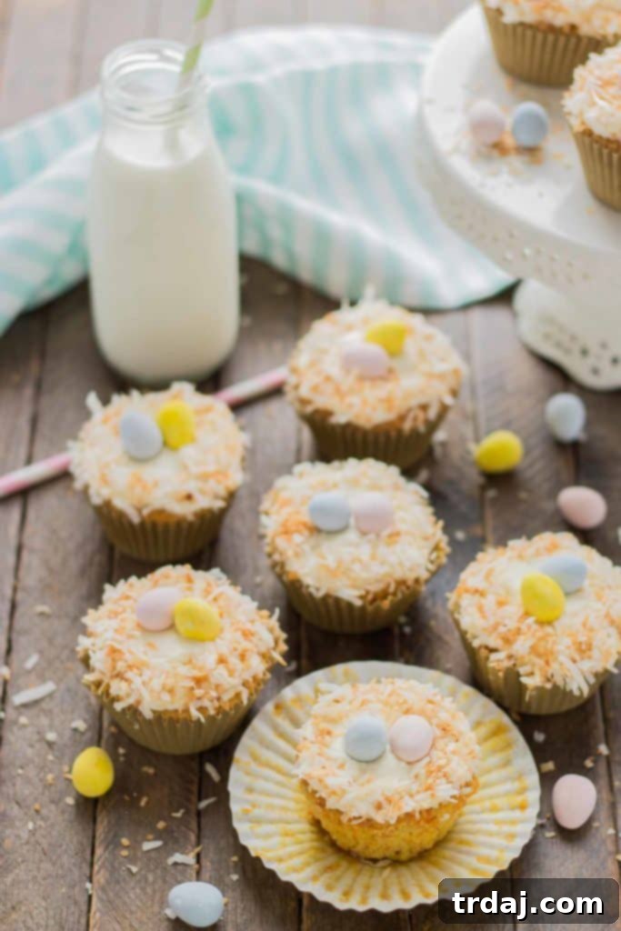 A close-up shot showcasing the beautiful texture of a Pineapple Carrot Cake Cupcake, ready to be served