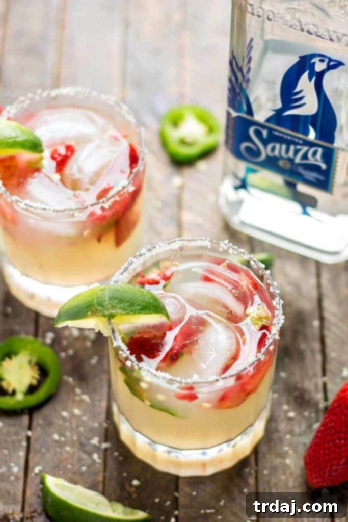 Lively Cinco de Mayo party setup with pitcher margaritas, DIY margarita bar, and colorful decorations featuring Sauza Tequila. Perfect for a festive gathering with friends.