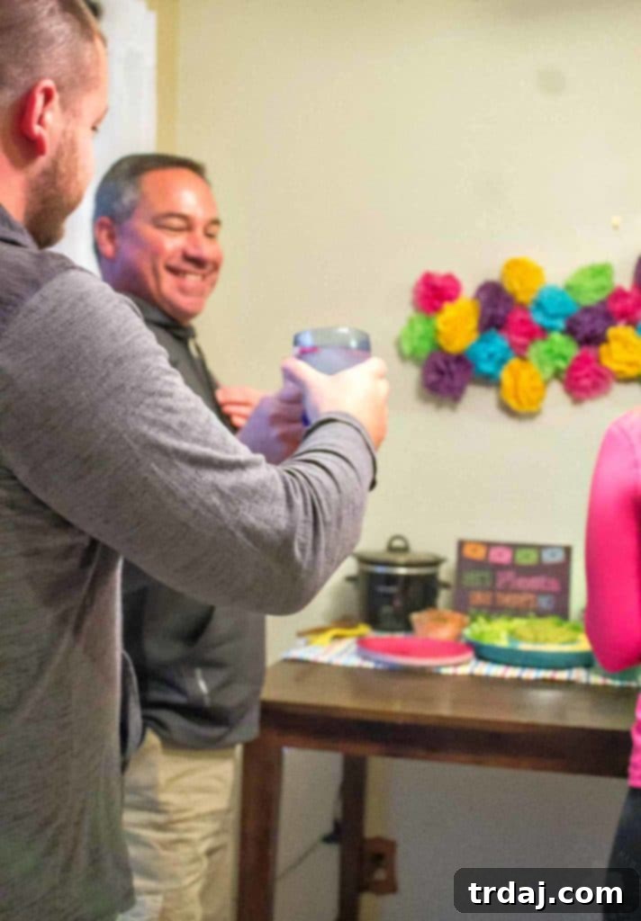 A bottle of Sauza Tequila against a colorful, festive backdrop, inviting celebration and good times.