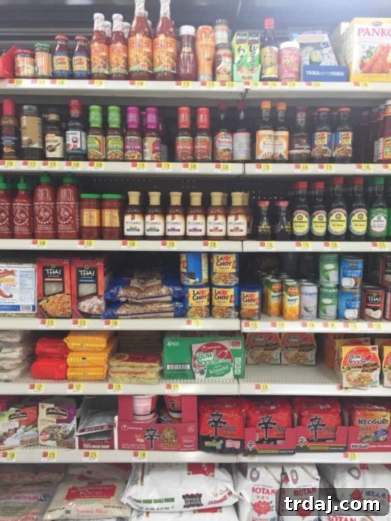 Crisp Sesame Noodle Slaw 4 P.F. Chang's Home Menu Sesame sauce bottle next to a bowl of fresh ingredients for the noodle slaw.