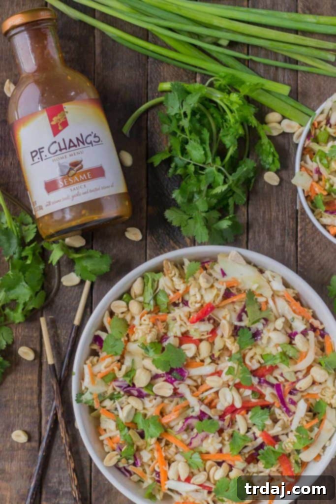Crisp Sesame Noodle Slaw 5 Ingredients for Asian Sesame Noodle Slaw laid out before mixing, highlighting fresh vegetables and P.F. Chang's sauce.