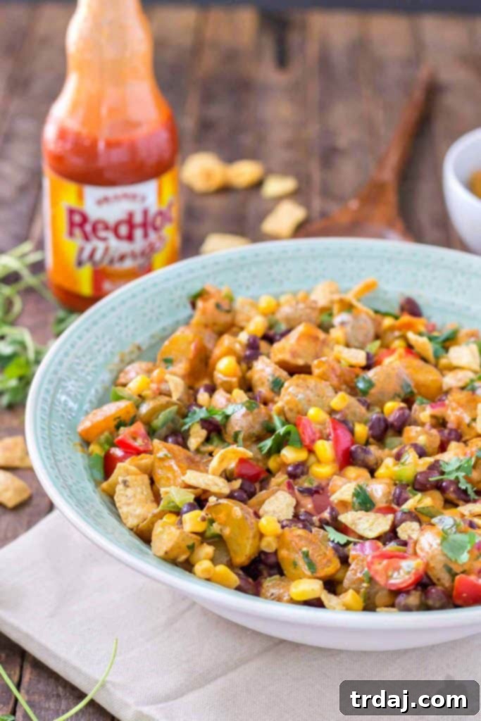 Fresh ingredients for Mexican Potato Salad: corn, black beans, cherry tomatoes, cilantro