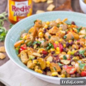 This Mexican Potato Salad is bursting with delicious flavor. Corn, black beans, cherry tomatoes, cilantro and Frank's Redhot Buffalo Wing Sauce make for one amazing side dish for all your summertime gatherings. | Strawberry Blondie Kitchen