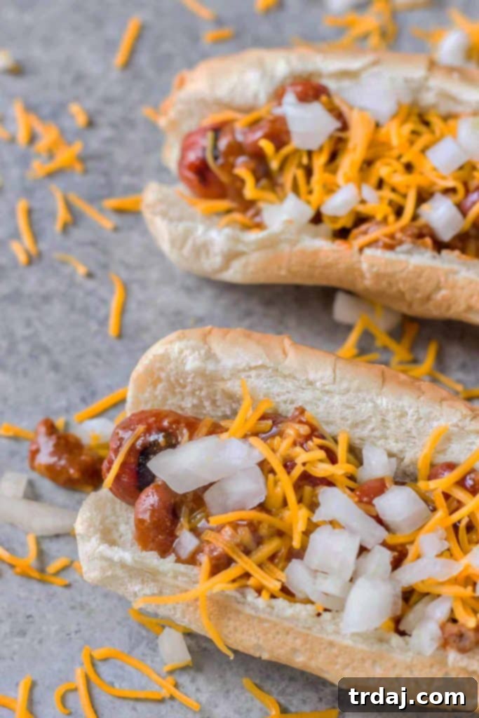 Effortless Chili Dogs 4 Ingredients for Easy Chili Dogs including hot dogs, buns, chili, and cheese, ready for a delicious meal.