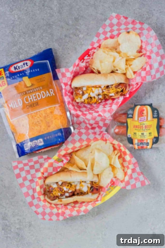 Effortless Chili Dogs 7 Grilled hot dogs in buns, ready for chili and cheese toppings for an Easy Chili Dog meal.