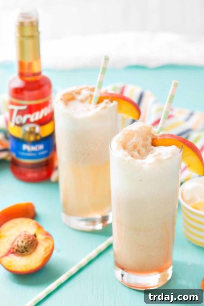 Delicious Peaches and Cream Soda, a perfect 4-ingredient summer drink made with Torani Peach syrup, cream, ice cream, and club soda.