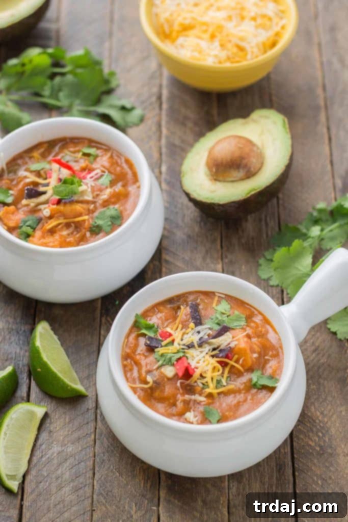 One-Pot Chicken Enchilada Soup cooking on the stove, perfect for busy weeknights