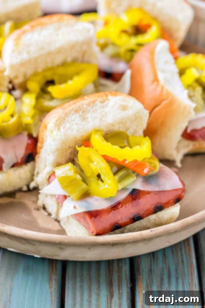 Windy City Smoked Italian Sausage Sliders 6 A vibrant platter of Chicago Style Italian Smoked Sausage Sliders, ready for serving at a gathering.