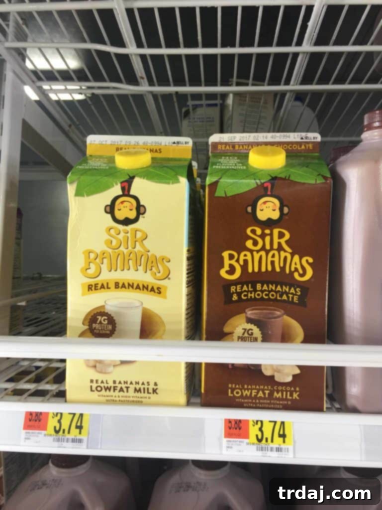 A bottle of Sir Bananas® Bananamilk alongside a glass of the delicious banana milk, ready for use in recipes or enjoyed on its own.