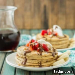 A delicious banana split pancake with fresh fruit, whipped cream, and chocolate syrup.