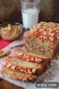 Peanut Butter and Jelly Banana Bread is a PB & J lovers dream!  Switch up the jelly to create your ultimate sandwich in a baked bread form.