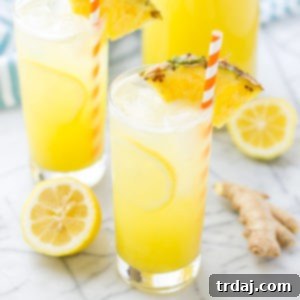 Zesty Pineapple Kick 4 A glass of Pineapple Ginger Lemonade, a refreshing summer drink.