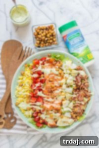 BBQ Salmon Cobb Salad with Avocado Ranch Dressing, a flavorful and healthy meal topped with crunchy ranch chickpeas.