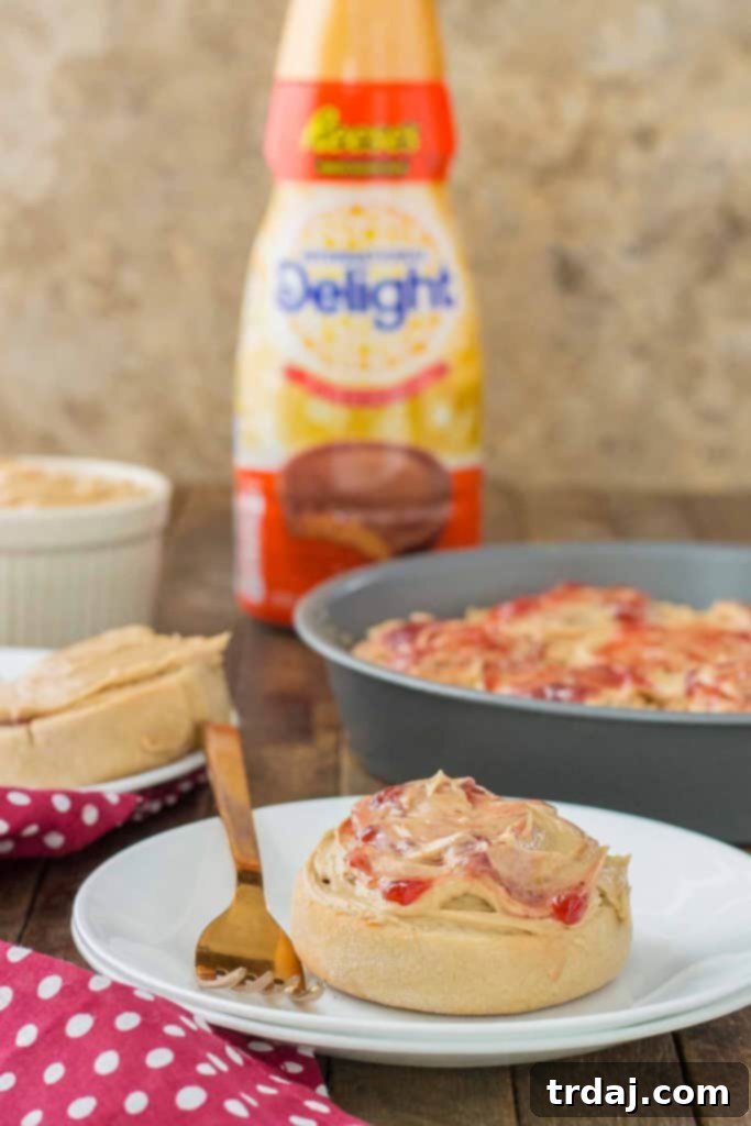 Homemade Peanut Butter and Jelly Breakfast rolls topped with rich peanut butter frosting, perfect for a delightful morning treat. | Strawberry Blondie Kitchen